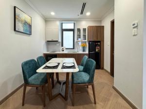a kitchen and dining room with a table and chairs at CityHouse TERA The S in Ho Chi Minh City