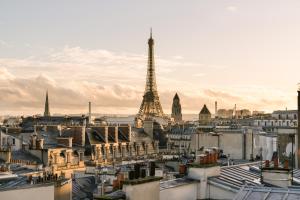 a view of a city with the eiffel tower at Hôtel Atala Champs Elysees in Paris +39 photos