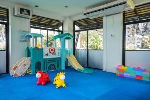 a childrens play room with a slide and toys at KC Grande Resort Koh Chang in Ko Chang
