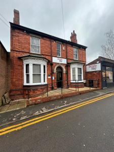 a brick building on the side of a street at Simplystay St Martins in Lincoln