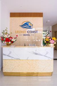 a sign for a loreona coast hotel in a lobby at Leono Coast Beach Hotel Phu Quoc in Phú Quốc