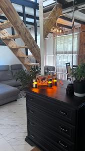 a dresser with candles on top of it in a room at CzarnyGaj in Gaj +10 photos