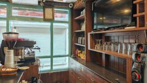 a kitchen with a counter with a coffee maker at Nextdoor Thamel in Kathmandu