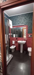 a bathroom with two sinks and a toilet at BF SUITE Foresteria Bellusci in Rho +41 photos
