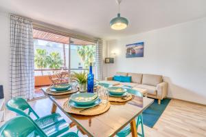 a living room with a table and chairs at Ideal Property Mallorca - Bella Italia in Alcudia