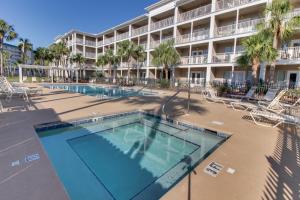 an image of a swimming pool at a resort at Cozy top-floor beachfront condo with pool pool spa & beach access in Perdido Key