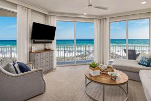 a living room with a view of the ocean at Stunning beachfront condo with shared pool & beach access in Santa Rosa Beach