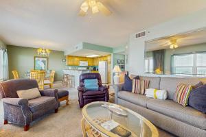 a living room with a couch and chairs and a table at Beautiful beachfront condo with shared pool & beach access in Fort Walton Beach