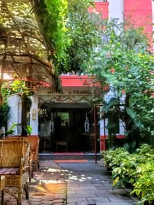 an entrance to a building with trees and plants at Hotel Tranquil in Kathmandu