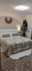 a bedroom with a large bed in a room at Casa dei sospiri in Polignano a Mare
