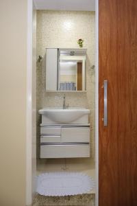 a bathroom with a sink and a mirror at Diamantina Palace Hotel in Morro do Chapéu +88 photos