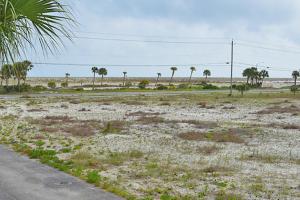 an empty field with palm trees and a road at 3rd Floor Spacious Condo Close To Entertainment Shared pool Wifi in Navarre