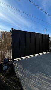 a black fence in front of a building at Apartmani Djordjevic in Belgrade
