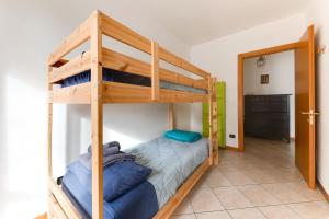 a bedroom with a bunk bed with a ladder at Residenza Quadrifoglio in Cesena