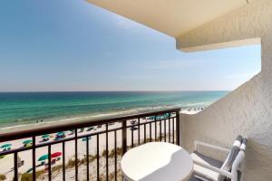 a balcony with a view of the beach at Comfortable 6th-floor beachfront condo with ocean views - walkable locale in Fort Walton Beach