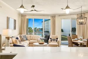 a living room with a couch and chairs at Chic first-floor condo with Gulf & pool view & pickleball - steps to beach in Santa Rosa Beach