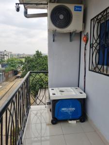 a balcony with a cooler and a air conditioner at Home Soft in Douala