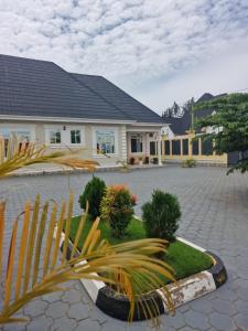 a large house with a courtyard with a house at Mamucha Grand Lodge in Arusha