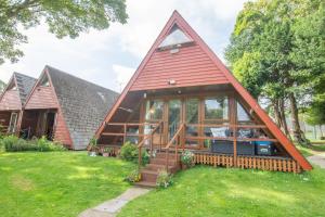 a small house with a red roof at Chalet Three in Deal