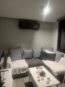 a living room with a couch and a table at Zarko Home in Drama