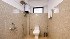 a bathroom with a toilet and a shower at Sumitel Sonam Lachung in Lachung +19 photos