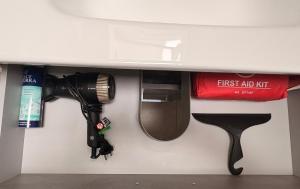 a flashlight and a camera hanging under a table at Soul house in Corsico