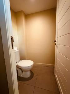 a bathroom with a white toilet in a room at Be Cosy Private Villa - Trou aux Biches in Triolet +13 photos