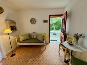a living room with a couch and a table at Villa Athena Skiathos in Megali Ammos +290 photos