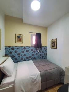 a bedroom with a bed in a room at Wander Luxe hostel in Tirana +40 photos