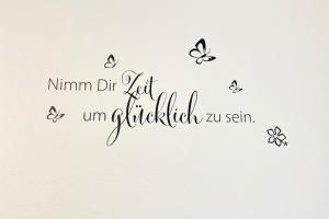a calligraphy inscription mummy die not unwritten with butterflies at Gartenblick in Lübbenau +12 photos
