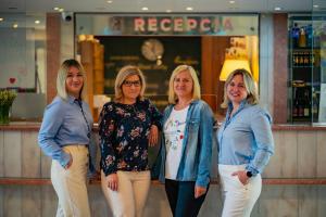 a group of women standing in front of a store at Hotel Mazowiecki Łódź in Łódź +123 photos