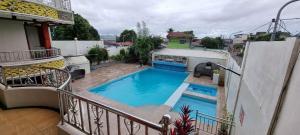 a view of a swimming pool from a balcony at Crestscente Skye Villa Resort in Pañgil +1 photo