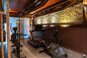 a gym with exercise equipment in a room at San Francisco Hotel Monumento in Santiago de Compostela