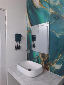 a bathroom with a sink and a mirror on a counter at Thundi Ocean View in Maalhos +47 photos
