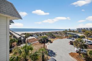 an aerial view of a beach with palm trees at SC304A: 304A Sea Cabin in Isle of Palms