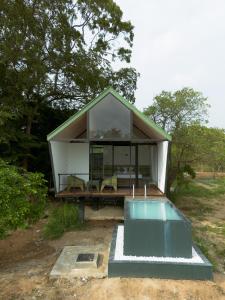 a small house with a pool in front of it at VerdEra Wild - Wilpattu in Wilpattu