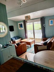 a living room with a couch and a table at Pensilva in Hayle