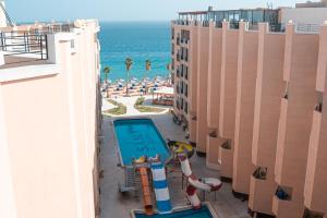 a view of the beach from the balcony of a resort at Juliana Beach Hurghada in Hurghada