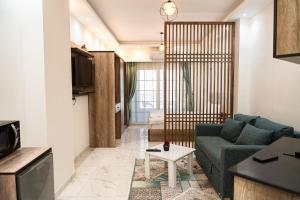 a living room with a couch and a table at Juliana Beach Hurghada in Hurghada