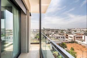 a balcony with a view of a city at Makass Appart Hotel in Rabat