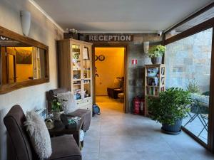 a living room filled with furniture and a yellow door at St Trifon Guests Apartments in Pamporovo