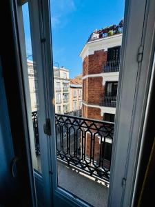 a view from a window of a building at Hostal Sol Square Madrid in Madrid