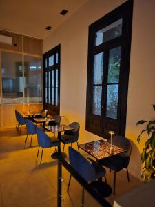 a group of tables and chairs in a room at Hotel Boutique Ubuntu in Buenos Aires +71 photos