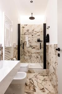 a bathroom with a toilet and a shower at Piazza del Popolo Boutique GuestHouse in Rome