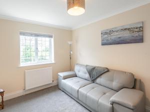 a living room with a couch and a window at Dawson Park 7 - Uk12666 in Mablethorpe