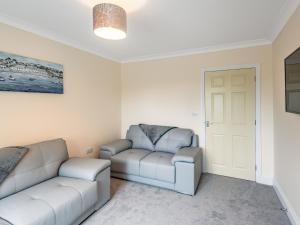 a living room with two couches and a door at Dawson Park 7 - Uk12666 in Mablethorpe +9 photos