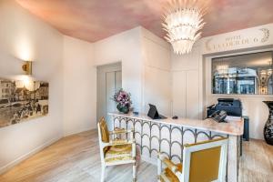 an office with a desk and chairs at Hôtel La Cour du 6 in Annecy