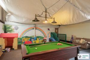 a playroom with a pool table and a play room at Birchenfield Holiday Cottages in Dilhorne
