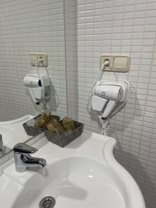 חדר רחצה ב-Hostal Treinta6