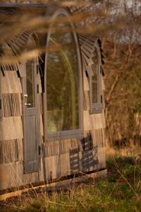 an old window and door of a house at Boath Cabin in Auldearn +1 photo